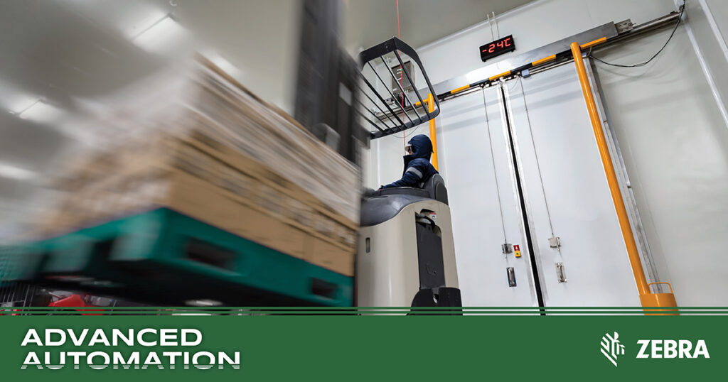 Photo of a worker on a fork lift driving through large sensor equipment in a refrigerated warehouse used for food products.